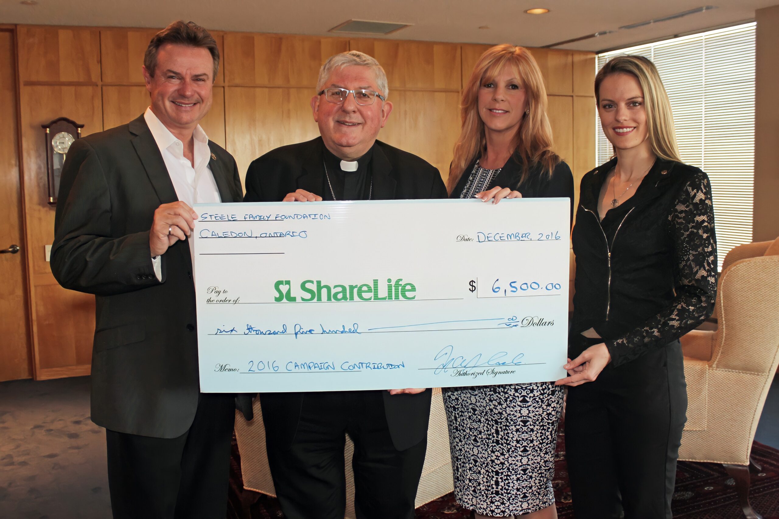 A Steele family donation presentation in support of ShareLife.