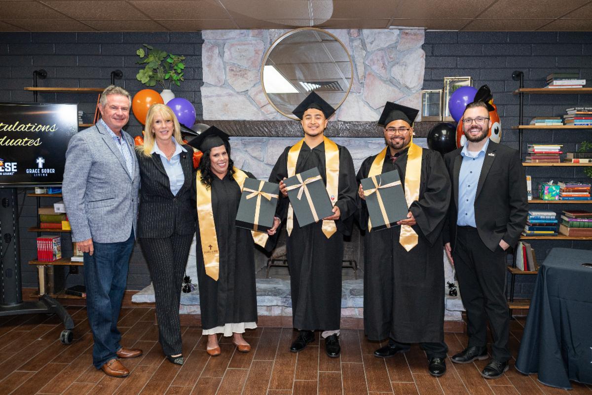 The graduating WISE scholars at Grace Sober Living celebrate with Michael and Stacey Steele and a fellow supporter.